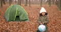 Little girl with globe in autumn forest. Explorer, travelling concept. 92433258