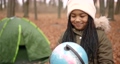 Little girl with globe in autumn forest. Explorer, travelling concept. 92433259
