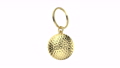 Gold keychain with golf ball on white background 93132353