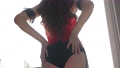 Erotic seductive movements of a woman in a red corset 93383718
