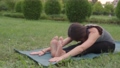 Female yoga instructor seated forward fold, paschimottanasana, seated yoga pose, flexibility 93413234