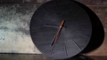 Black round arrow clock with a red arrow. Time lapse, time goes by quickly. 93480020