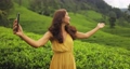 Selfie or Video Call on Smartphone of Traveler Woman During Her Travel on Famous Nature Landmark Tea Plantations in Sri Lanka 93869992