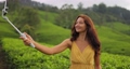 Selfie or Video Call on Smartphone of Traveler Woman During Her Travel on Famous Nature Landmark Tea Plantations in Sri Lanka 93870032