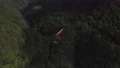 綺麗な山の谷に架かる真っ赤な橋を空撮 93875911
