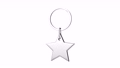 Shiny silver keyring with star on white background 93926638