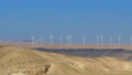 Wind turbines in the desert with blue sky background. Wind farm in Jordan desert 94344444