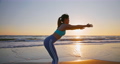 woman practice yoga on beach 94362743