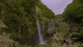 奄美 タンギョの滝の空撮 (旋回 / 4K 60p) 94517525