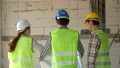 Group of Asian engineer or Young Female Architect put on a helmet for safety and talk with a contractor on a construction building factory project, Concept of Teamwork, Leadership concept. 94552539
