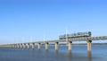 茨城県　青空の北浦橋梁を走る電車 94568493