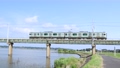 茨城県　青空の北浦橋梁を走る電車 94568495