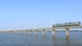 茨城県　青空の北浦橋梁を走る電車 94568497