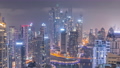 View of various skyscrapers in tallest recidential block in Dubai Marina aerial all night timelapse 94577932