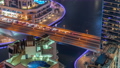 Dubai Marina waterfront and city promenade night timelapse from above. 94577934