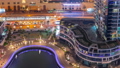 Dubai Marina waterfront and city promenade night timelapse from above. 94577936