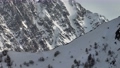 Aerial view from drone to telephoto lens, multidimensional mountains, rocks and ridges. Snow-covered mountain peaks rocks in the mountains. winter epic video background 94578644