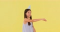 birthday child girl in blue dress and party hat dancing 95443551