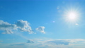 Beautiful scenic blue sky with rays of sun shining through clouds. Sun rays. Time lapse. 95879198