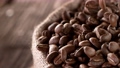 Coffee beans fall. Super slow motion at 1000 fps, filmed on high speed cinematic camera. 95903722