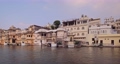 Udaipur Lal Ghat old houses and haveli view from boat. Rajput architecture of Mewar dynasty rulers tourist Indian landmark. Incredible India. Horizontal camera truck 96083210