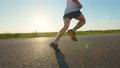 Close up of man wearing shorts, T-shirt and sneakers running fast in road. Sportsman, athlete jogging, working out, exercising, training endurance. Concept of sport and running. 96485868
