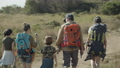 Back view of Caucasian family with backpacks hiking together. 96519674
