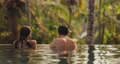 Couple Together Relaxation and Spending Time in Infinity Swimming Pool Outdoors During Tropical Vacation  96907362