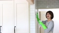 General cleaning, Japanese housewife cleaning the wall tiles with a smile 96967906