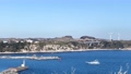 城ヶ島公園展望台からの眺望、港に戻る船と風力発電機の風車 99742666