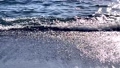太陽の光が波に踊る長浜海水浴場の波打ち際【スローモーション】 99929358