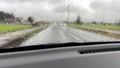 Rainy day Car driving in the countryside slow 106189409